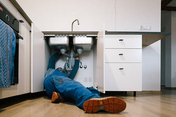 Professional Plumbing technician working in Elkmont, AL
